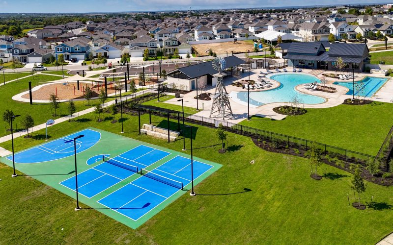 Aerial image of Harvest Ridge amenities, such as a pickleball court and the swimming pool