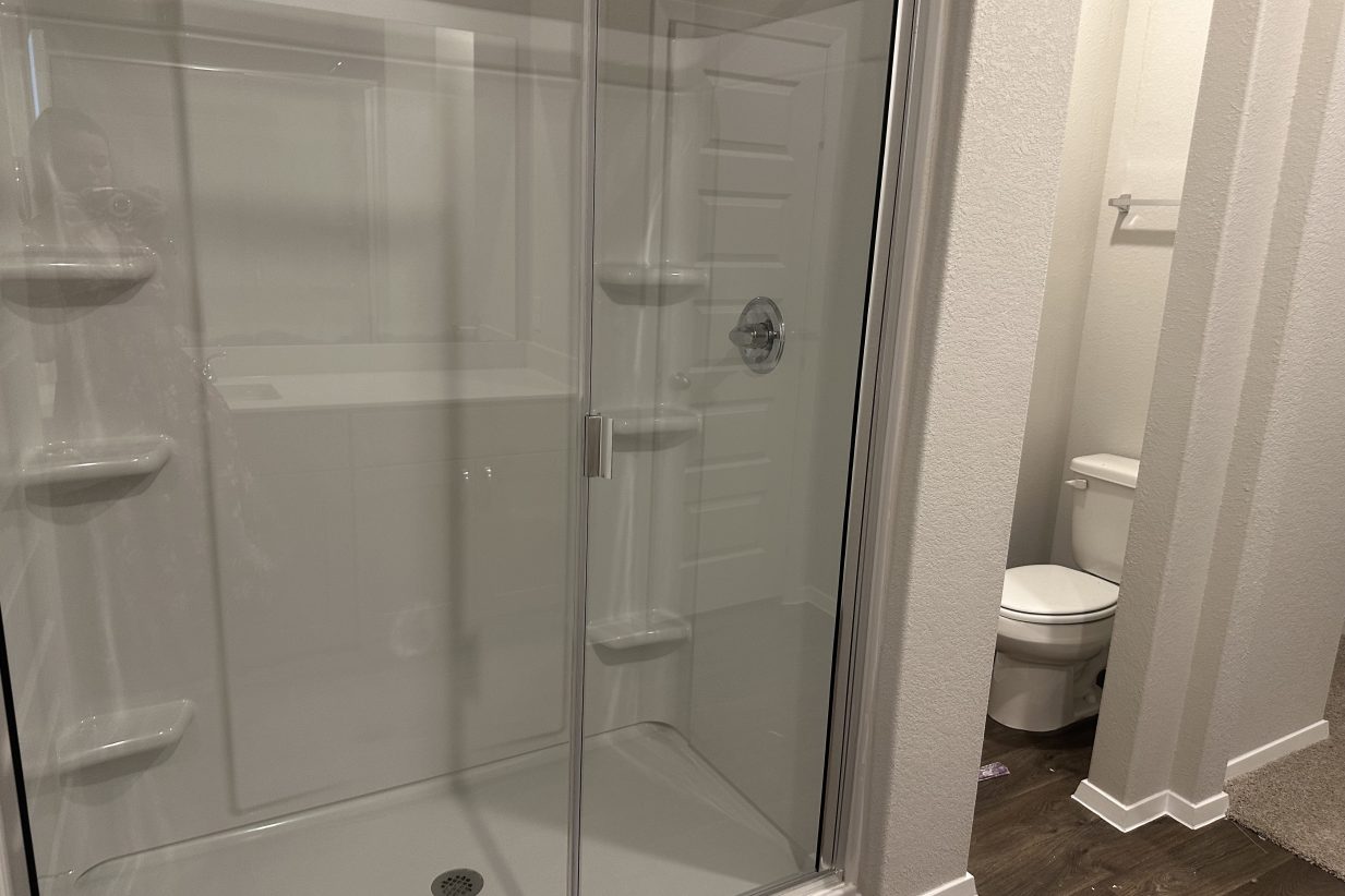 Image of walk-in shower and semi-private water closet